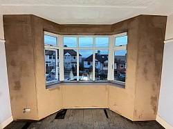 Internally Insulated wall plastered ready for painting